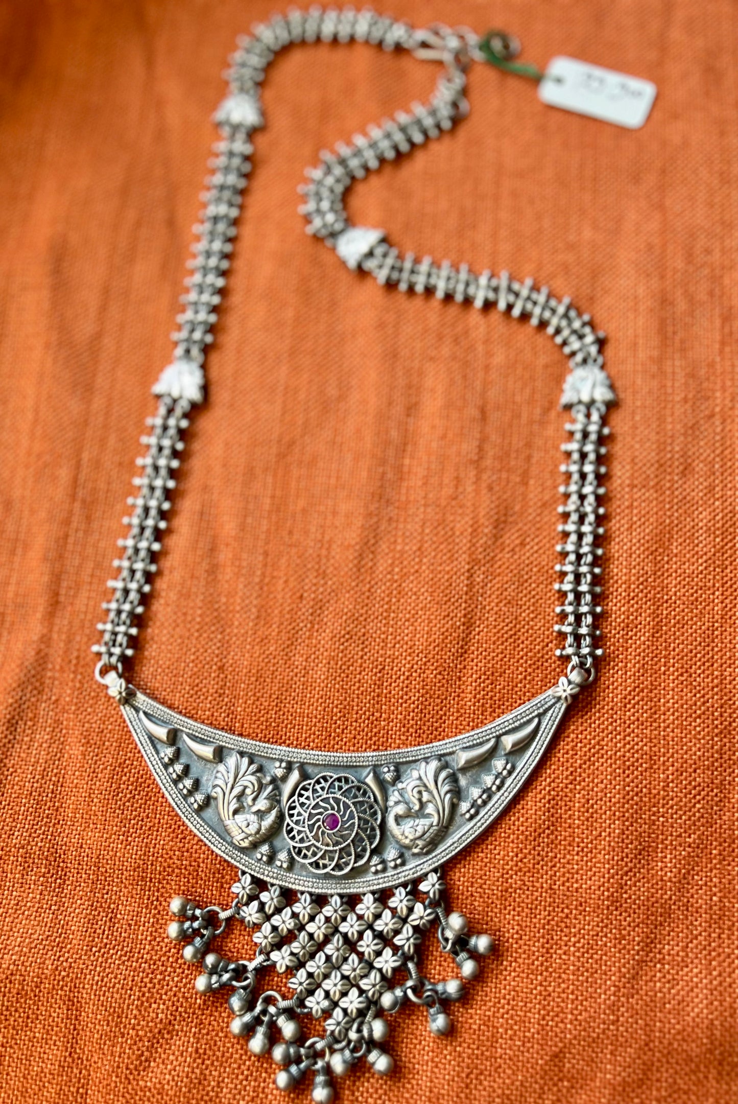 Silver long peacock motif necklace