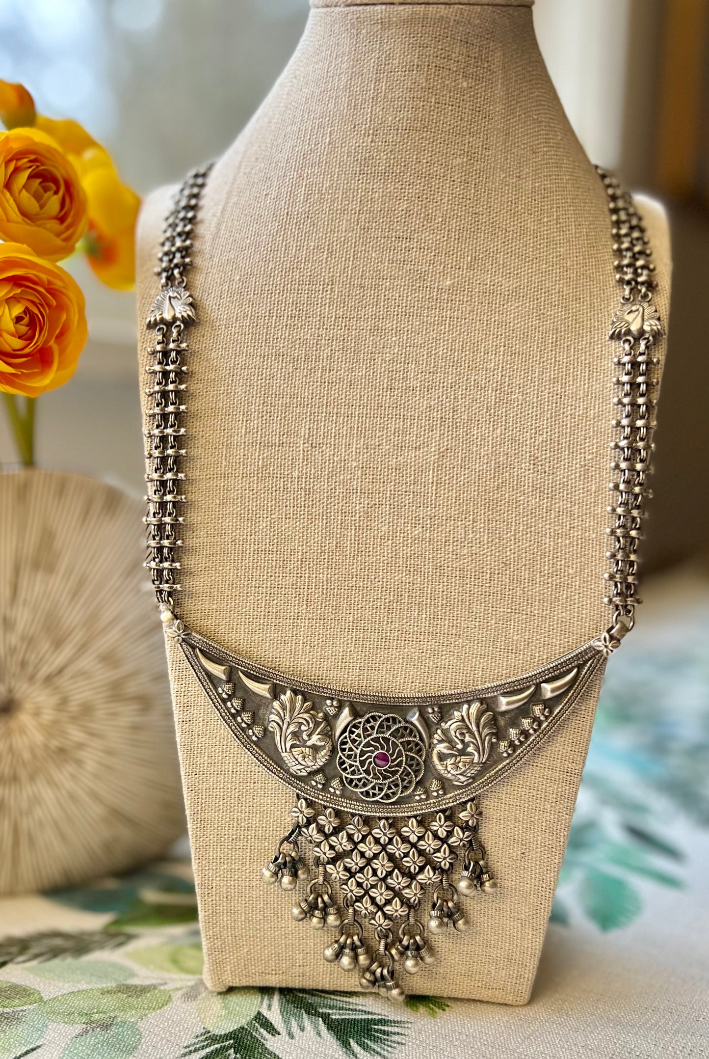 Silver long peacock motif necklace