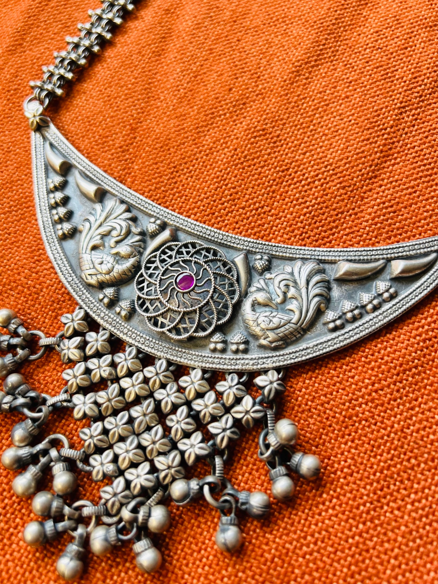 Silver long peacock motif necklace